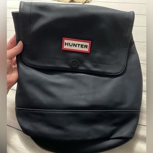 Hunter navy blue backpack. Yellow lining.